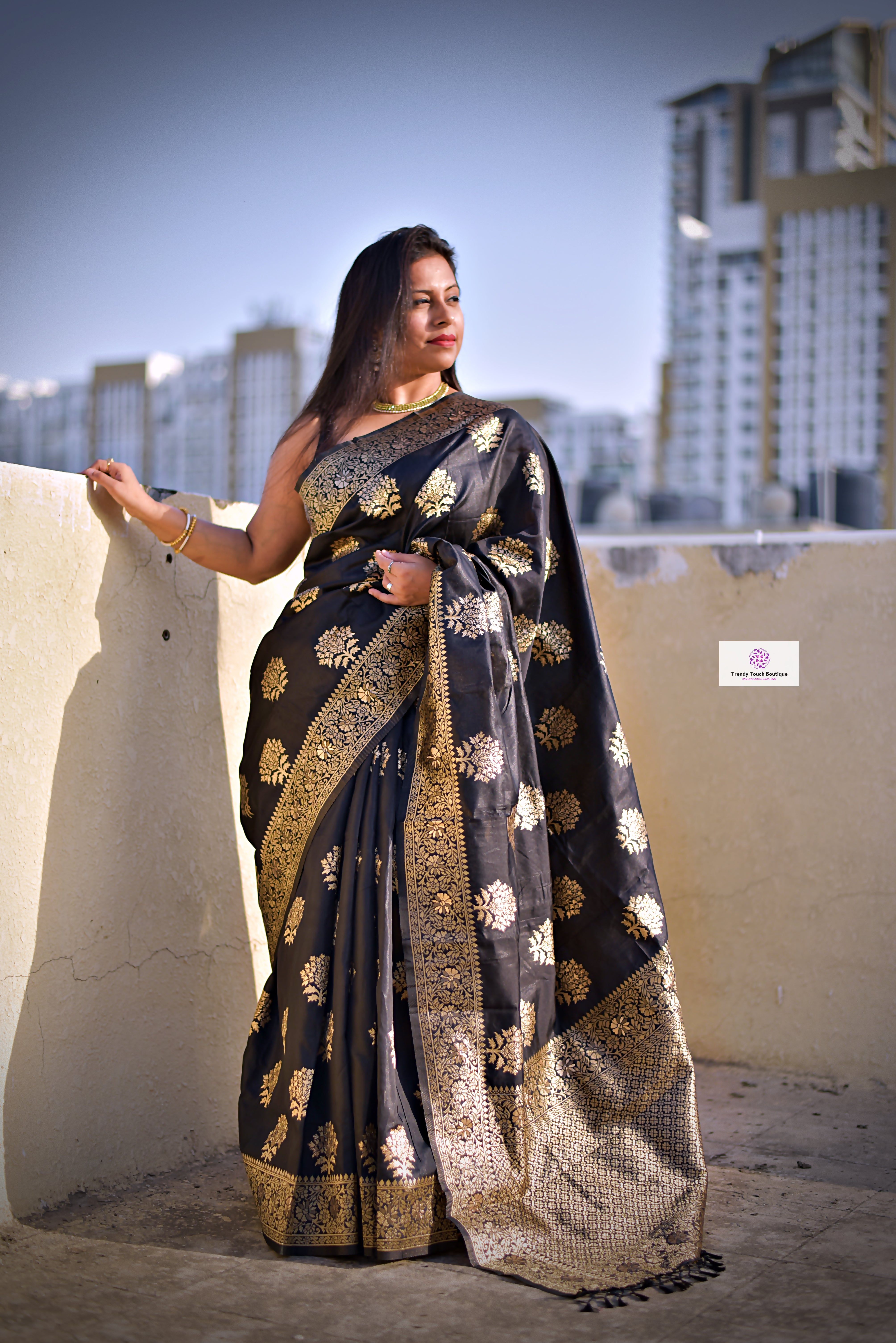 black with big gold border silk saree and blouse